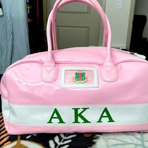 A light, shiny, pink & cute over night/makeup bag! Has pockets on the inside!